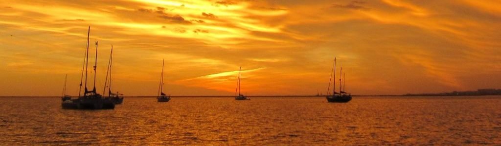 orange sky and water of a sunset sky at Ilha da Culatra