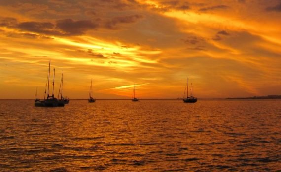 orange sky and water of a sunset sky at Ilha da Culatra