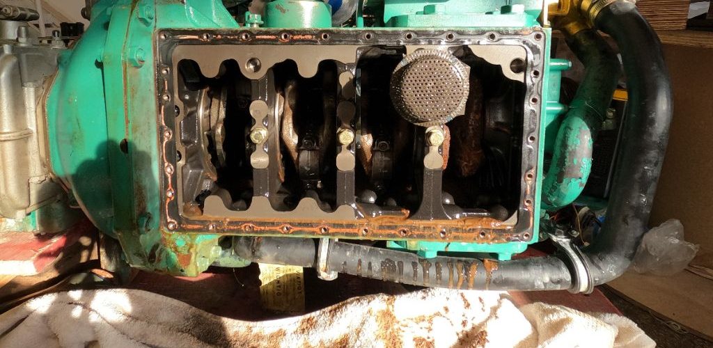 looking inside a broken sailboat engine