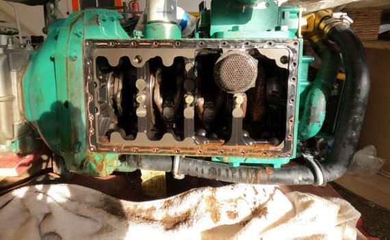 looking inside a broken sailboat engine